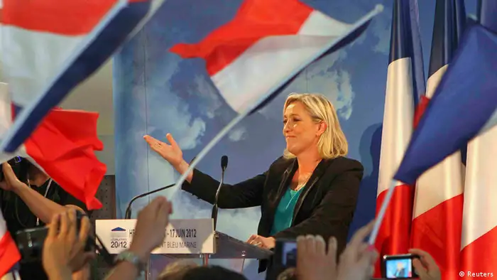 Marine Le Pen, France's National Front leader and candidate for the legislative elections, reacts as she speaks with supporters after she lost in the run-off election in Henin-Beaumont June 17, 2012. REUTERS/Jean-Yves Bonvarlet (FRANCE - Tags: POLITICS ELECTIONS)