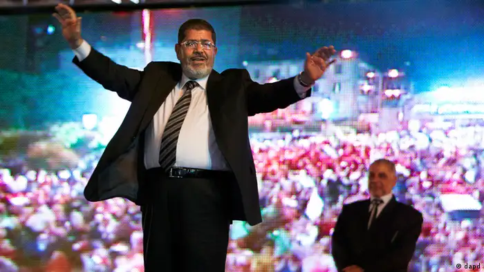 FILE - In this Sunday, May 20, 2012 file photo, the Muslim Brotherhood's presidential candidate Mohammed Morsi holds a rally in Cairo, Egypt. The Muslim Brotherhood has declared that its candidate, Mohammed Morsi, won Egypt's presidential election, early Monday, June 18, 2012.(AP Photo/Fredrik Persson, File)