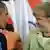 U.S. President Barack Obama (L) and German Chancellor Angela Merkel (C) talk REUTERS/Andres Stapff (MEXICO - Tags: POLITICS)