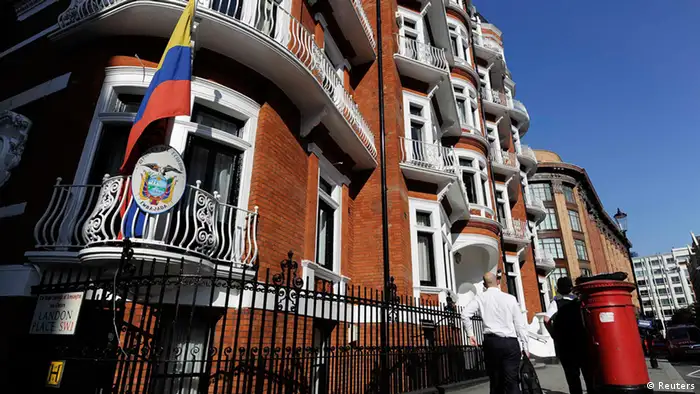 A man walks past Ecuador's embassy in London June 20, 2012. WikiLeaks' founder Julian Assange has taken refuge in Ecuador's embassy in London and asked for asylum, officials said on Tuesday, in a last-ditch bid to avoid extradition to Sweden over sex crime accusations. REUTERS/Paul Hackett (BRITAIN - Tags: POLITICS CRIME LAW)