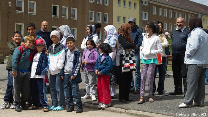 A large group of asylum seekers in Eisenhüttenstadt