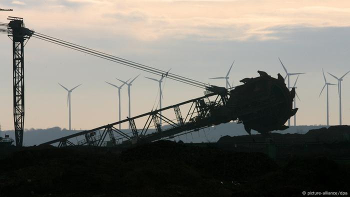 Bucket wheel excavator and wind turbines in the background