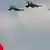 Turkish Air Force fighters fly over a national flag during a ceremony on the Victory Day in Ankara, Turkey