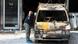 A police officer investigates a destroyed van outside the entrance of Microsoft office in northern Athens, Wednesday, June 27, 2012. A police officer investigates a destroyed van outside the entrance of Microsoft office in northern Athens, Wednesday, June 27, 2012.