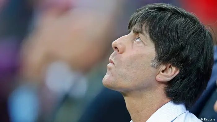Germany's coach Joachim Loew concentrates before the Euro 2012 semi-final soccer match against Italy at National Stadium in Warsaw, June 28, 2012. REUTERS/Thomas Bohlen (POLAND - Tags: SPORT SOCCER)