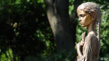 flowers at a monument to Holodomor victims in Kiev, Ukraine, Tuesday, July 21, 2009. The Holodomor refers to the famine of 1932?1933 in the Ukrainian when millions of people starved to death because of the Soviet policies that forced farmers into collective farms. (ddp images/AP Photo/Sergei Chuzavkov)