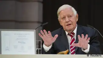 REFILE - CORRECTING TITLE OF HELMUT SCHMIDT Former German Chancellor Helmut Schmidt gestures after he received the Eric Warburg Award from the NGO Atlantic Bridge at the German Historical Museum in Berlin, July 2, 2012. The non-governmental organisation Atlantic Bridge honours people with the Eric M. Warburg Award for their achievements in promoting the German-American friendship, its website said. REUTERS/Thomas Peter (GERMANY - Tags: POLITICS)