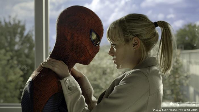 Emma Stone hugs Spider-Man in a still from The Amazing Spider-Man