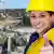 Woman wearing yellow helmet on a building site © Jürgen Fälchle #39809429 - Fotolia.com