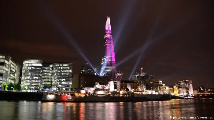 The Shard seen from the Tower Millennium Pier during a laser show to celebrate it's inauguration ceremony in London. 5th July 2012.