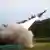 A HAWK (Homing All the Way Killer) surface-to-air missile is launched to a target on a live fire test at Jeoupeng military base in Pingtung County, Southern Taiwan, Monday, July 9, 2012. (AP Photo/Chiang Ying-ying)