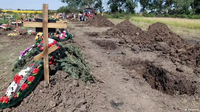 Graves, dug for flood victims, are seen at the central cemetery in Krymsk in the Krasnodar region, southern Russia, July 9, 2012. Russia began a day of mourning on Monday for the 171 people killed in floods that drove thousands from their homes, with the causes of the disaster posing hard questions for the authorities, including President Vladimir Putin. REUTERS/Eduard Korniyenko (RUSSIA - Tags: DISASTER ENVIRONMENT POLITICS OBITUARY)