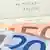 Euro banknotes on a bill