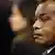 Congo's president Denis Sassou-Nguesso looks sideways towards the camera