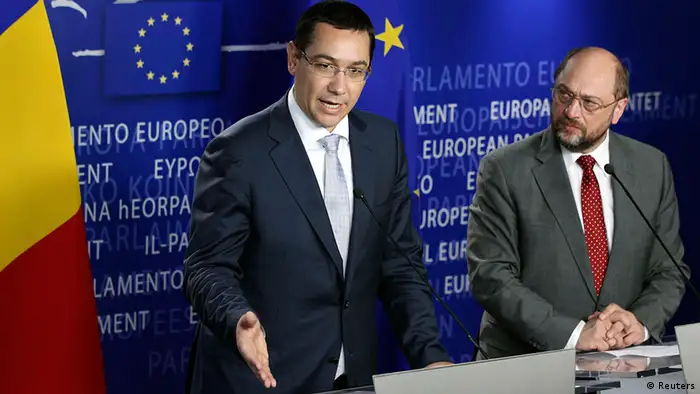 Romania's Prime Minister Victor Ponta and European Parliament President Martin Schulz (R) address a joint news conference after their meeting at the EU Parliament in Brussels July 11, 2012. Romania's prime minister assured European leaders on Wednesday that his government was fully committed to democracy and the rule of law after drawing fire for suspending President Traian Basescu by a vote in parliament. REUTERS/Francois Lenoir (BELGIUM - Tags: POLITICS)