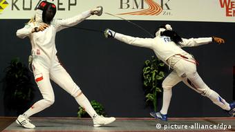 Magdalena Piekarska of Poland and Laura Flessel-Colovic of France compete during WestEnd women's individual epee Grand Prix fencing final in Budapest, Hungary.