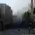 Scene showing smoke-filled Damascus street