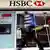 A pedestrian passes a branch of HSBC bank in London, Monday, Feb. 27, 2012. Buoyant trading in Asia helped HSBC Holdings PLC, Europe's biggest bank by market value, report a 28 percent increase in full-year profit Monday, a marked contrast to the performance of other big British banks. (Foto:Kirsty Wigglesworth/AP/dapd)