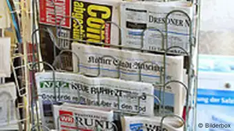 A rack of German newspapers