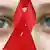 Червона стрічка - символ солідарності із хворими на СНІД