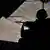 Ein Heckschütze der Bundeswehr sichert am Dienstag (03.07.2012) einen Hubschrauberflug von Kundus nach Masar-i-Scharif. Bundesverteidigungsminister de Maiziere (CDU) besucht für einen Tag Bundeswehrsoldaten in Afghanistan. Foto: Hannibal dpa