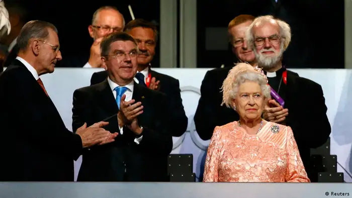 Britain's Queen Elizabeth attends the opening ceremony of the London 2012 Olympic Games with International Olympics Committee President Jacques Rogge (L), German Olympic Sports Confederation (Deutscher Olympischer Sportbund, DOSB) President Thomas Bach (2nd L) and Archbishop of Canterbury Rowan Williams (back R) at the Olympic Stadium July 27, 2012. REUTERS/Kai Pfaffenbach (BRITAIN - Tags: SPORT OLYMPICS ENTERTAINMENT ROYALS)