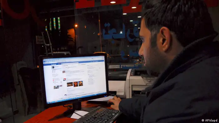 A Syrian man connects on his Facebook account at an internet cafe, in Damascus, Syria, on Tuesday Feb. 8, 2011. A media watchdog said Tuesday that Syria appears to be lifting a three-year-old ban on YouTube and Facebook, a decision that could be seen as a gesture to stave off unrest following popular uprisings in Egypt and Tunisia. The Syrian government does not comment on its Internet restrictions. But several Internet users in Syria told The Associated Press on Tuesday that the sites were accessible for the first time in years without having to tunnel through a proxy servers. Lifting the ban may well be an example of such reforms, but it is not a major concession by Assad. The ban had little practical effect, with many Syrians using proxy servers to access the sites every day. (AP Photo/Muzaffar Salman)