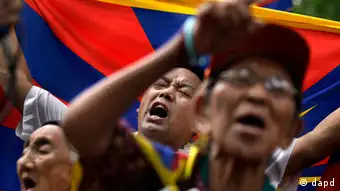 Tibetan exiles shout slogans during a protest against the Chinese government in Delhi, India, Friday, July 13, 2012. (AP Photo/Saurabh Das)