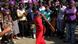A woman in a red dress surrounded by fellow protesters in Harare Privilege Musvanhiri A woman in a red dress surrounded by fellow protesters in Harare Privilege Musvanhiri