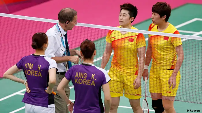 An official (2nd L) speaks to players from China and South Korea during their women's doubles group play stage Group A badminton match during the London 2012 Olympic Games at the Wembley Arena in this July 31, 2012 file photo. Top badminton officials met at Wembley Arena on August 1, 2012 to decide the fate of four women's doubles pairs charged with misconduct for attempting to lose their Olympic matches to secure a more favourable draw. From left: South Korea's Kim Ha-na, Jung Kyung-eun, China's Yu Yang and Wang Xiaoli. REUTERS/Bazuki Muhammad/Files (BRITAIN - Tags: SPORT BADMINTON OLYMPICS)