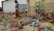 People inspect the site of a suicide bombing in Yemen's southern city of Jaar People inspect the site of a suicide bombing in Yemen's southern city of Jaar