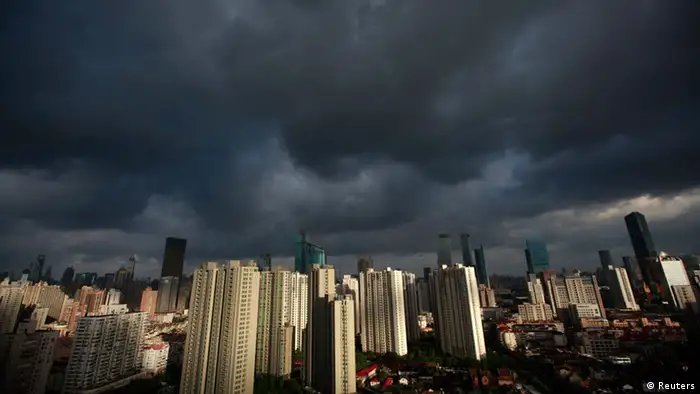 Source News Feed: EMEA Picture Service ,Germany Picture Service Dark clouds cover the sky in downtown Shanghai, August 6, 2012. Heavy rains will hit many areas in south and east China from Sunday to Tuesday, as Typhoon Haikui is moving northwestward from Okinawa, Japan, to affect China's coastal region, the National Meteorological Center (NMC) said on Sunday, Xinhua News Agency reported. REUTER/Aly Song (CHINA - Tags: SOCIETY CITYSPACE ENVIRONMENT)