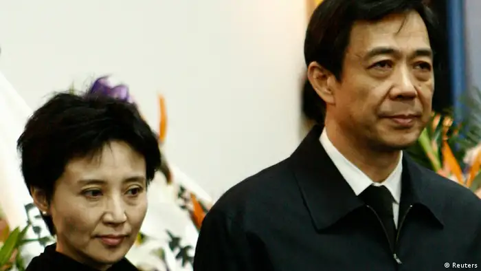 China's former Chongqing Municipality Communist Party Secretary Bo Xilai (R) and his wife Gu Kailai stand at a mourning held for his father Bo Yibo, former vice-chairman of the Central Advisory Commission of the Communist Party of China, in Beijing in this January 17, 2007 file photo. China holds its most sensational trial this week since convicting the Gang of Four over 30 years ago, putting Gu Kailai, the wife of deposed leader Bo Xilai, in the dock for murder. Legal experts and activists expect her to receive the kind of rapid guilty verdict handed down in almost all Chinese criminal trials - the kind Gu once compared favourably to the United States where she felt the guilty risked going free on legal technicalities. Picture taken January 17, 2007. REUTERS/Stringer/Files (CHINA - Tags: CRIME LAW POLITICS) CHINA OUT. NO COMMERCIAL OR EDITORIAL SALES IN CHINA