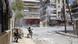 A Free Syrian Army fighter prepares to fire an RPG as a Syrian Army tank shell hits a building across a street during heavy fighting in Salaheddine neighborhood of central Aleppo A Free Syrian Army fighter prepares to fire an RPG as a Syrian Army tank shell hits a building across a street during heavy fighting in Salaheddine neighborhood of central Aleppo