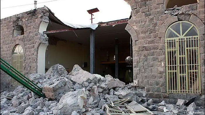 A damaged building is seen in this undated handout photo taken in an undisclosed location in northwest Iran. Two powerful earthquakes killed 250 people and injured around 1,800 in northwest Iran, where rescue workers frantically combed the rubble of dozens of villages throughout the night and into Sunday as medical staff desperately tried to save lives. REUTERS/Hamed Nazari/Mehr News Agency (IRAN - Tags: DISASTER) FOR EDITORIAL USE ONLY. NOT FOR SALE FOR MARKETING OR ADVERTISING CAMPAIGNS. THIS IMAGE HAS BEEN SUPPLIED BY A THIRD PARTY. IT IS DISTRIBUTED, EXACTLY AS RECEIVED BY REUTERS, AS A SERVICE TO CLIENTS