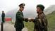 NATHU LA PASS, INDIA: A Chinese army officer (L) exchanges greetings with his Indian counterpart following a meeting among the officers, as they stand on the border of Nathu La, some 52 kilometres (33 miles) east of Gangtok, 05 July 2006. Formal trading is due to begin at the 15,000-foot (4,545 metre) Nathu La Pass on the border between India's Sikkim state and China's Tibet region. Indian businessmen and local people expect a change in the region's economy patterns following the formal resumption of trade between India and China when the Nathu La Pass, along the historic Silk Route, re-opens. AFP PHOTO/ STR (Photo credit should read STRDEL/AFP/Getty Images) NATHU LA PASS, INDIA: A Chinese army officer (L) exchanges greetings with his Indian counterpart following a meeting among the officers, as they stand on the border of Nathu La, some 52 kilometres (33 miles) east of Gangtok, 05 July 2006. Formal trading is due to begin at the 15,000-foot (4,545 metre) Nathu La Pass on the border between India's Sikkim state and China's Tibet region. Indian businessmen and local people expect a change in the region's economy patterns following the formal resumption of trade between India and China when the Nathu La Pass, along the historic Silk Route, re-opens. AFP PHOTO/ STR (Photo credit should read STRDEL/AFP/Getty Images)