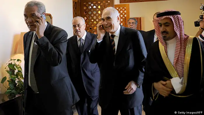Egyptian Foreign Minister Mohammed Kamel Amr (C) talks on his phone upon his arrival to attend a preparation meeting of foreign ministers of the Organisation of Islamic Cooperation (OIC) in the Saudi coastal city of Jeddah on August 13, 2012. Leaders of Muslim countries, including Iran's pro-Syrian President Mahmoud Ahmadinejad, are due to gather for an extraordinary summit called by Saudi King Abdullah who is pushing to mobilise support for the Syrian rebellion. AFP PHOTO/FAYEZ NURELDINE (Photo credit should read FAYEZ NURELDINE/AFP/GettyImages)