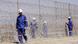 Workers install razor wire at the Lonmin platinum mine(Photo:Denis Farrell/AP/dapd) Workers install razor wire at the Lonmin platinum mine(Photo:Denis Farrell/AP/dapd)
