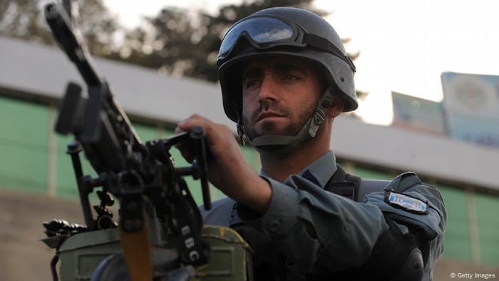An Afghan policeman stands guard near the site where a suspected suicide bomber was shot dead near a major elders' meeting in Kabul on November 14, 2011. A suspected suicide bomber carrying a bag of explosives was shot dead in Afghanistan on November 14 near the site of a major elders' meeting set to discuss relations with the US, officials said. The man was gunned down in Kabul hours after the Taliban claimed to have published a top-secret security plan for the loya jirga, which starts on November 16 and will bring together over 2,000 elders from around the country. AFP PHOTO/SHAH Marai (Photo credit should read SHAH MARAI/AFP/Getty Images)