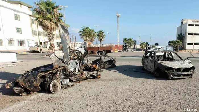 Damaged cars are pictured after an explosion near a women's police academy in Tripoli, August 19, 2012. Two explosions struck the Libyan capital of Tripoli on Sunday, one near the Interior Ministry and the second near a women's police academy, a Libyan security officer told a Reuters photographer. REUTERS/Ismail Zitouny (LIBYA - Tags: CIVIL UNREST)
