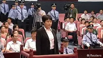 Gu Kailai (front, C), wife of ousted Chinese Communist Party Politburo member Bo Xilai, attends a trial in the court room at Hefei Intermediate People's Court in this file still image taken from video August 9, 2012. A Chinese court will deliver its verdict on August 20, 2012 against Gu Kailai on charges of killing a British businessman last year in a scandal that has shaken the Communist Party's transition to a new leadership. REUTERS/CCTV via Reuters TV/Files (CHINA - Tags: CRIME LAW POLITICS) FOR EDITORIAL USE ONLY. NOT FOR SALE FOR MARKETING OR ADVERTISING CAMPAIGNS. THIS IMAGE HAS BEEN SUPPLIED BY A THIRD PARTY. IT IS DISTRIBUTED, EXACTLY AS RECEIVED BY REUTERS, AS A SERVICE TO CLIENTS. CHINA OUT. NO COMMERCIAL OR EDITORIAL SALES IN CHINA