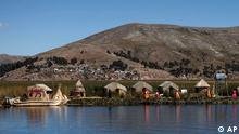 Residents walk at at one of the Uros floating islands on the Titicaca lake in Puno, Peru, Sunday, May 29, 2011. Tourism has diminished in the islands due to the anti-mining strike in Puno that is being held since May 9. The Uros islands are known as floating ones because they are made of totora, a plant that grows on the Titicaca lake, and that is woven to form a floating surface. (Foto:Juan Karita/AP/dapd)