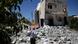 Syrian Nasif Hashoum, 54, looks at the rubble of a house destroyed in a Syrian government airstrike in Anadan, on the outskirts of Aleppo, Syria, Wednesday, Aug. 22, 2012. Photo:Muhammed Muheisen/AP/dapd Syrian Nasif Hashoum, 54, looks at the rubble of a house destroyed in a Syrian government airstrike in Anadan, on the outskirts of Aleppo, Syria, Wednesday, Aug. 22, 2012. Photo:Muhammed Muheisen/AP/dapd