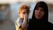 A new Syrian refugee and her child are pictured as they arrive at a stopover facility for breaking fast near the Turkish border town of Reyhanli in Hatay province August 9, 2012. More than 2,000 people fled violence in Syria to reach neighbouring Turkey in the past two days, bringing the total number of Syrians who have sought refuge there to more than 50,000, Turkish authorities said on Thursday. REUTERS/Umit Bektas (TURKEY - Tags: POLITICS CIVIL UNREST SOCIETY) A new Syrian refugee and her child are pictured as they arrive at a stopover facility for breaking fast near the Turkish border town of Reyhanli in Hatay province August 9, 2012. More than 2,000 people fled violence in Syria to reach neighbouring Turkey in the past two days, bringing the total number of Syrians who have sought refuge there to more than 50,000, Turkish authorities said on Thursday. REUTERS/Umit Bektas (TURKEY - Tags: POLITICS CIVIL UNREST SOCIETY)