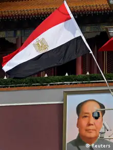 Egypt's national flag flies in front of the giant portrait of former Chinese Chairman Mao Zedong at Tiananmen Square in Beijing, August 28, 2012. Egyptian President Mohamed Mursi is on a three-day visit to China from August 28 to 30. REUTERS/Petar Kujundzic (CHINA - Tags: POLITICS)