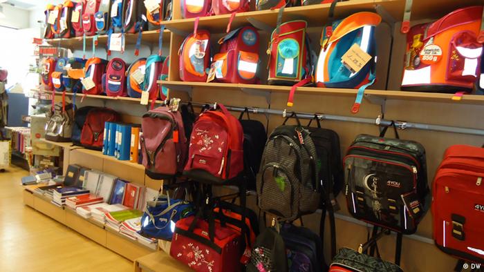 Backpacks, binders and noteworks line the shelves of a supply store