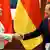 German Chancellor Angela Merkel shaking hands with Chinese Premier Wen Copyright: Ng Han Guan/AP/dapd