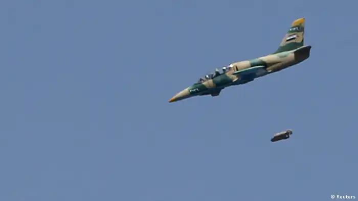 A Syrian Air Force fighter jet launches missiles at El Edaa district in Syria's northwestern city of Aleppo September 1, 2012. REUTERS/Youssef Boudlal (SYRIA - Tags: CONFLICT MILITARY)