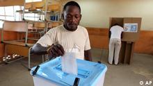 A man casts his ballot at a voting station in Kicolo, Luanda, Angola Friday, Aug. 31, 2012. Victory for the Popular Movement for the Liberation of Angola, (MPLA) would give Angola's ruler for 33 years , President Jose Eduardo dos Santos, another five-year term. (AP Photo/Str)