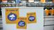 Stickers at an airport with messages such as "in case of strike, delay." Stickers at an airport with messages such as "in case of strike, delay."